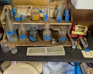 Verious turn of the century glass bottles, and Jennings Extracts metal shelf. 4 Repa Market Vents
