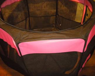 collapsible pet pen with zip in floor and top if needed folds into compact soft side carrying case