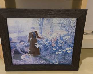 Claude Monet Camille Monet and a Child in the Artists Garden at Argenteuil Framed Print