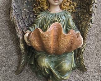 Angel Holding a Seashell Figurine