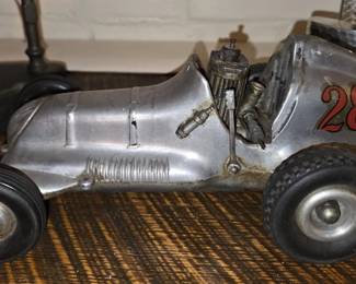 Cox Thimble Drome Champion tether race car “Number 28” made by the L M Cox Manufacturing Company in Santa Ana CA. Heavy Die cast aluminum body and powered by a small fuel engine in the driver’s seat area (circa 1950)