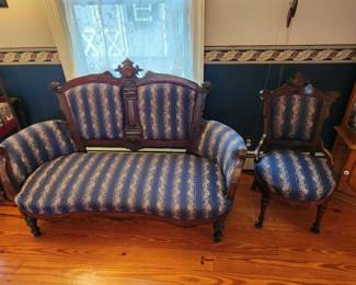 Victorian Parlor set – Walnut, turned legs, carved crest with medallion in center, scrolled ears, Circa 1860. Love seat, side chair, armchair, ladies chair (and two additional chairs with a different fabric).