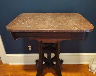 Victorian walnut marble top table with 4 legs, 24” x 17”