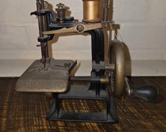 “Little Comfort Improved” child’s toy hand sewing machine made by the Smith and Egge Manufacturing Company of Bridgeport, CT (circa 1900)