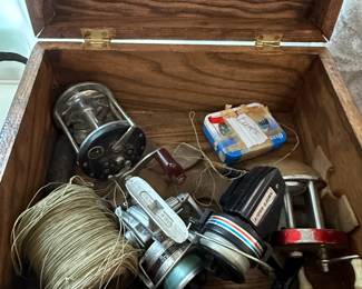 Vintage Wooden Tackle Box with Assorted Fishing Reels and Lures third image