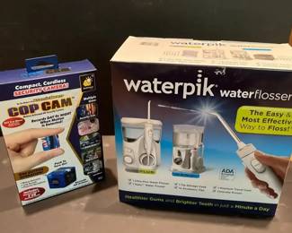 New in Box Waterpik Water Flosser and Cop Cam Security Camera