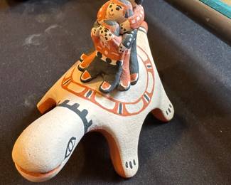 Mary O Chalan Chalan was born into Cochiti Pueblo in August 1939. Her parents were Raymond and Barbarita Herrera but she learned how to make pottery through watching and working with her mother-in-law, Helen Cordero. Mary made polychrome jars and bowls but was most known for her storytellers, turtles, bears, frogs and other figures