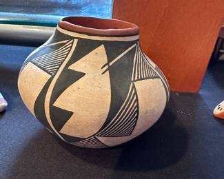 We have two E. Chino Acoma Pueblo Polychrome Pottery Pots signed Artist: C.G. Louis.