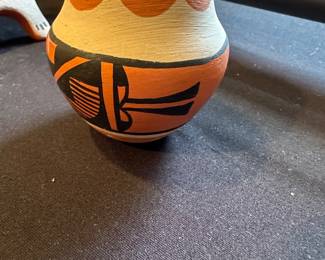 M S Toya refers to Mary S. Toya, a recognized Native American potter from the Jemez Pueblo in New Mexico. She is highly regarded for her hand-coiled, traditionally hand-painted clay art, including miniature figures, wedding vases, and storytellers