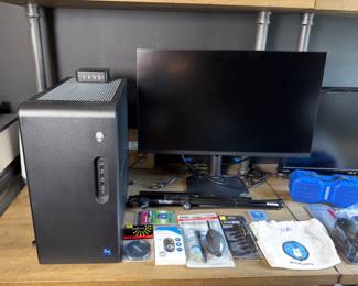 High-performance Alienware gaming setup including RTX graphics, liquid cooling, and matching monitor. Approximately one year old.