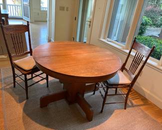 Versatile Antique Round Oak Pedestal Table With Leaves And Two Chairs