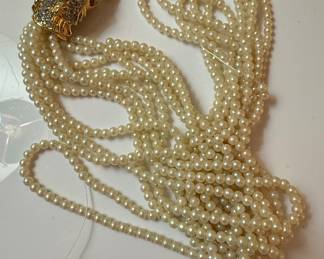 Multi-Strand Faux Pearl Necklace with Double Lion Head Clasp