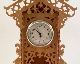 Handmade clock with beautiful scroll saw work.  Such precision.
