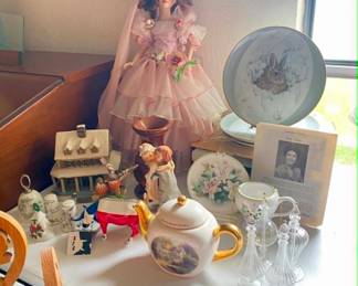 Porcelain doll, home decor and artist plate hangings.