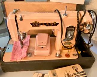 Vintage Atlas sewing machine!  Original owner's manual, accessories and buttonholer included.  Works great!