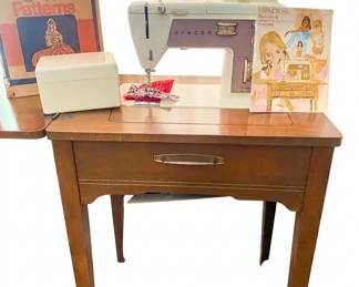 Singer Touch N Sew sewing machine and cabinet.  Comes with original owner's manual, accessories and Stretch n Sew Patterns.