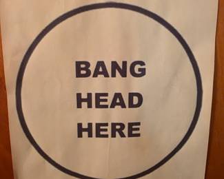 Bang head here sign