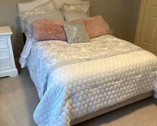 Sueded Fabric Full Bed And Headboard With Upholstery Tack Detail Plus Light Bedding