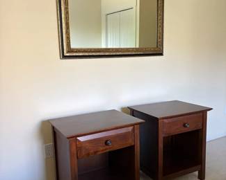 Pair Of Wood Nightstands And An Antiqueinspired Mirror