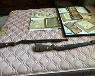 Vintage Rifles on a queen bed