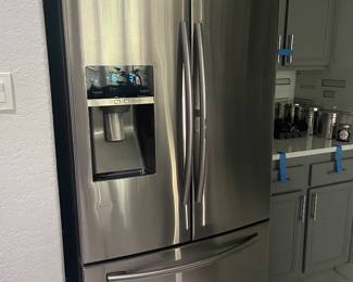nice stainless 3 door fridge -  available for pick up sunday  easy to remove rather than during the sale 