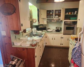 So much kitchen ware incluing Corningware, Cast Iron, 