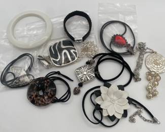 Assortment of Necklaces and Bracelets including Metal Glass and Leather Pendants