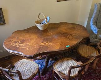 lovely dining table and 6 cane bottom chairs