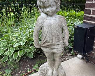 outdoor garden statue of a little girl