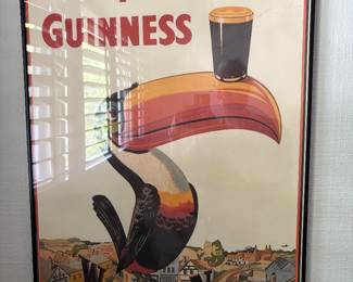 framed vintage Guinness poster with toucan