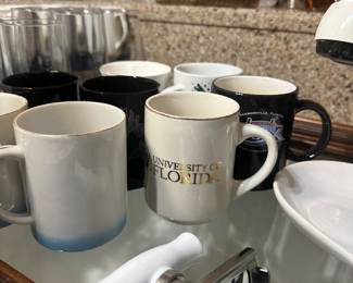 Assorted collectible coffee mugs