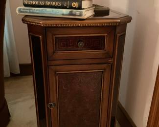 Mahogany-toned side table with decorative inlaid front