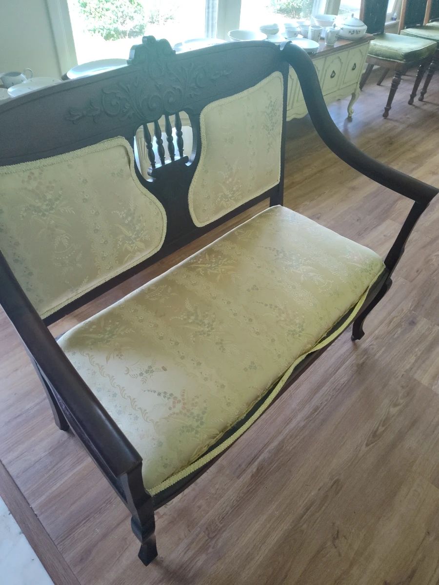 Antique Love Seat with wooden wheels