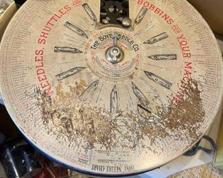 Antique sewing needle display