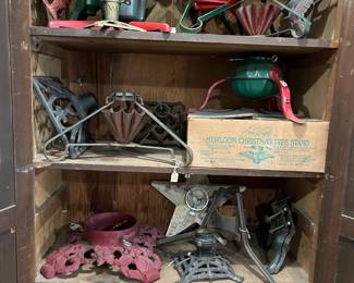 So many cast-iron antique Christmas tree stands