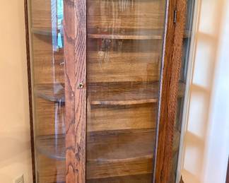 Curved glass cabinet w/wood shelves