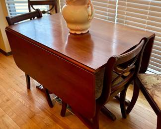 Antique drop leaf table with 4 chairs
