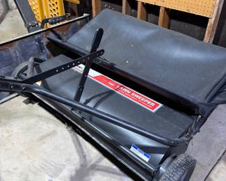 Lawn sweeper attachment