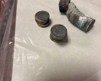 Pre-1965 Roosevelt Silver dimes fused together from the buried treasure pile