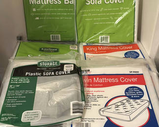 Lot 127: Storage cabinet with sofa cover and mattress bag packaging