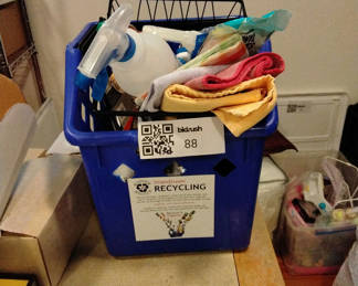 Lot 88: Blue recycling bin filled with cleaning supplies and drop cloths