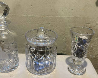 Lot 495: Waterford Crystal Decanter, Lidded Jar, and Footed Vase