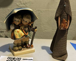 Lot 229: "Stormy Weather" Hummel #71 and brown-robed figure