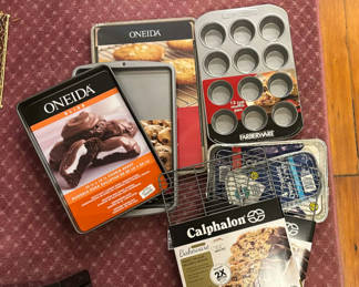 Lot 122: Assorted new bakeware collection (cookie sheets, muffin pans, and baking trays)
