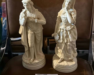 Lot 315: Pair of white porcelain figurines: man and woman in historical dress