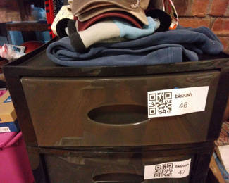 Lot 46: Stacked storage drawers with clothing and fabrics