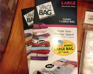 Lot 9: Space Bag storage packs, vacuum-seal bags, Pack-It compression jumbo, and face masks