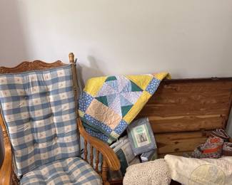 oak rocker, cedar chest, quilts, blankets 