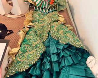 This is a collector gown. The artisan passed away about 10 years ago and was known for making the Rose Bowl festival gowns.