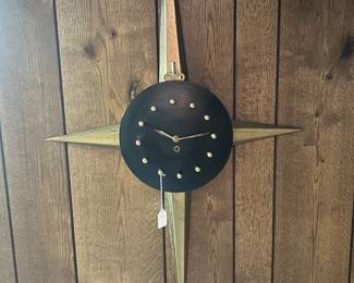 MCM metal starburst clock with candle sconces 